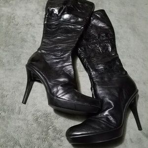 Pair of doll house brand high heel boots